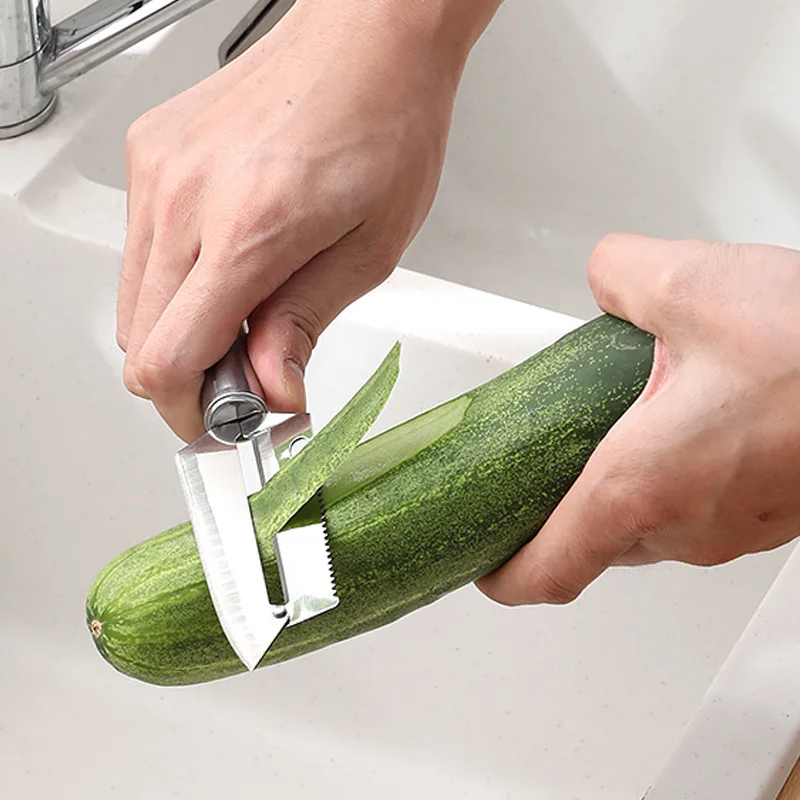 Versatile stainless steel kitchen tool for peeling fruits melons and precise cutting tasks features ergonomic black handle compa