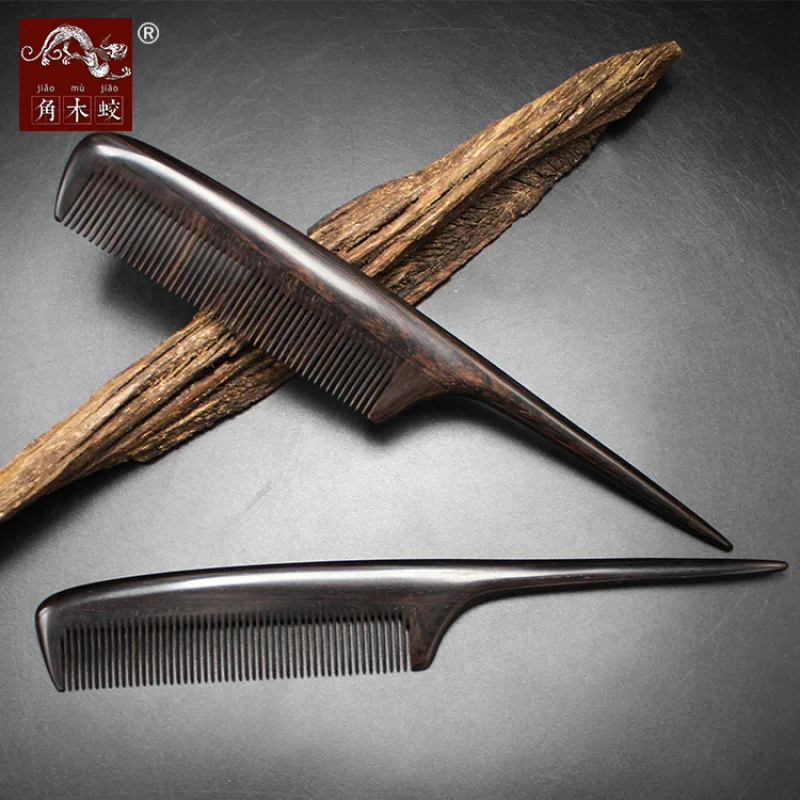 Ebony black sandalwood comb with fine teeth and a pointed tail for hair styling