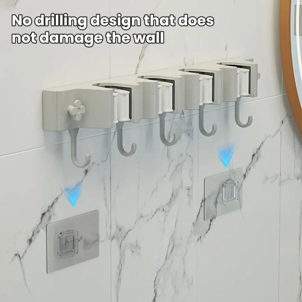 حامل مكنسة ذاتي اللصق يُثبت على الحائط حامل ممسحة لمنظم منزلي سهل مع قدرة تحمل قوية ومناسبة عالمية