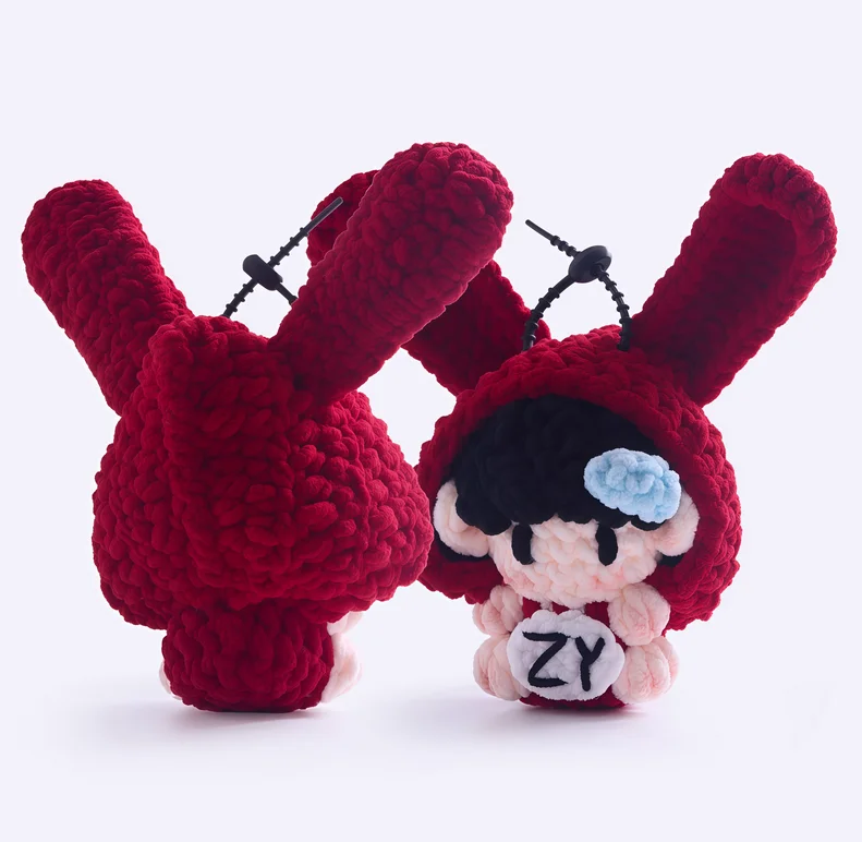 Gummy bear-themed merchandise, handmade crocheted dolls, concert support materials, and keychains.