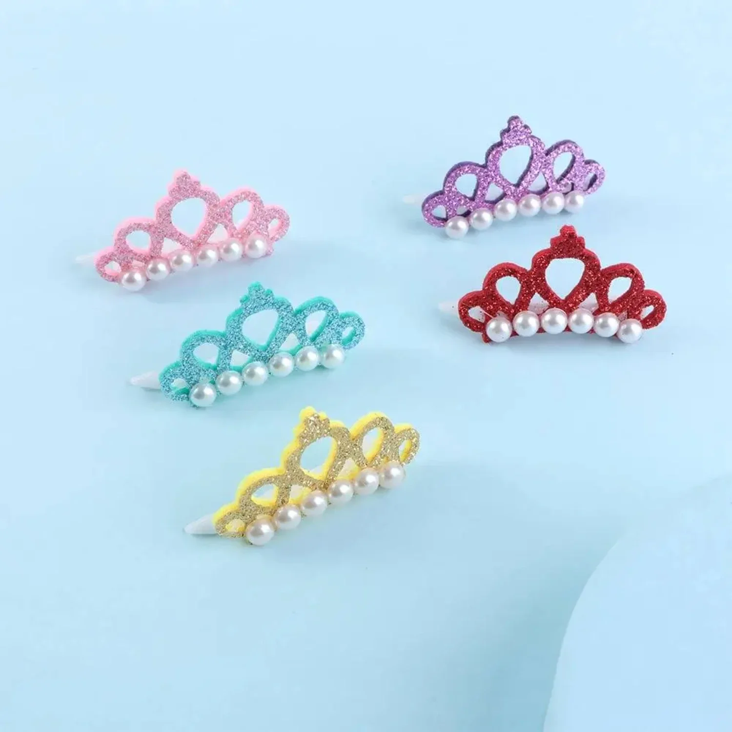 Adorable and charming faux pearl crown-shaped pet hair clips for styling and grooming your beloved furry friend with elegance. S