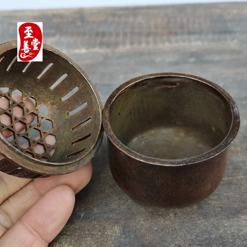 Antique-style copper alloy incense burner with a patina effect, designed for living room decoration, featuring a round, openwork