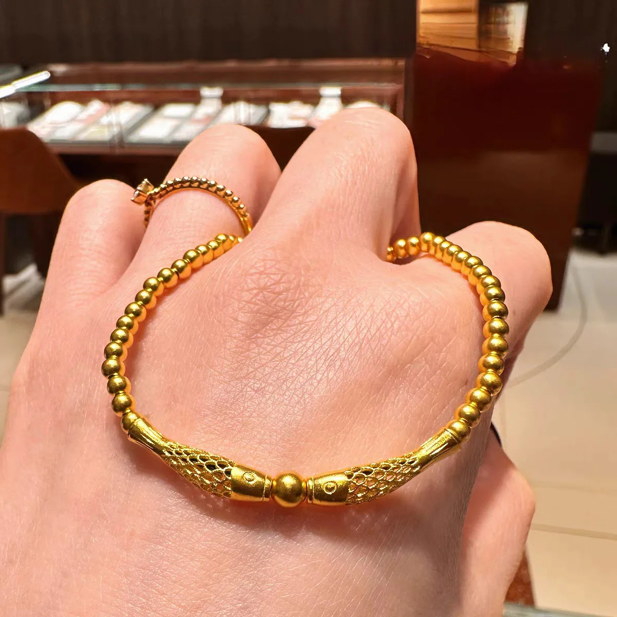 

Double Fish & Pearl Bracelet for Women, 24K Gold, AU999 | 3D gold fish chasing pearl on elastic cord, playful prosperity charm.