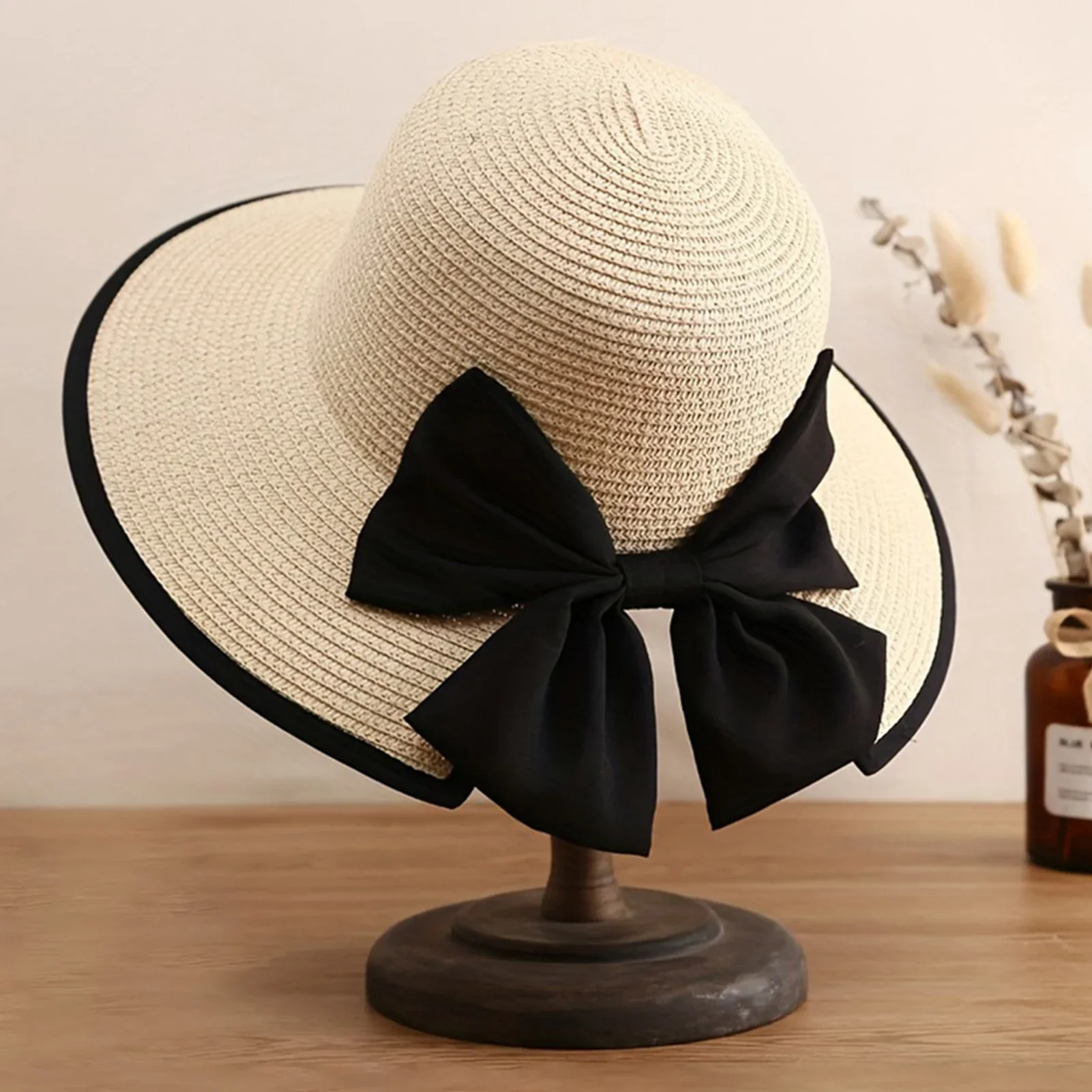 قبعة نسائية واسعة الحواف من القش مع عقدة على شكل فيونكة صيفية من القش قبعة الشمس لقضاء العطلات على الشاطئ وقبعات للحماية من الشمس للتصوير الفوتوغرافي للسفر في الهواء الطلق