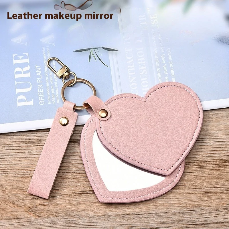 Espejo de maquillaje multifuncional de cuero PU con forma de corazón, llavero creativo, portátil, compacto con cadena para bolso, regalo de viaje