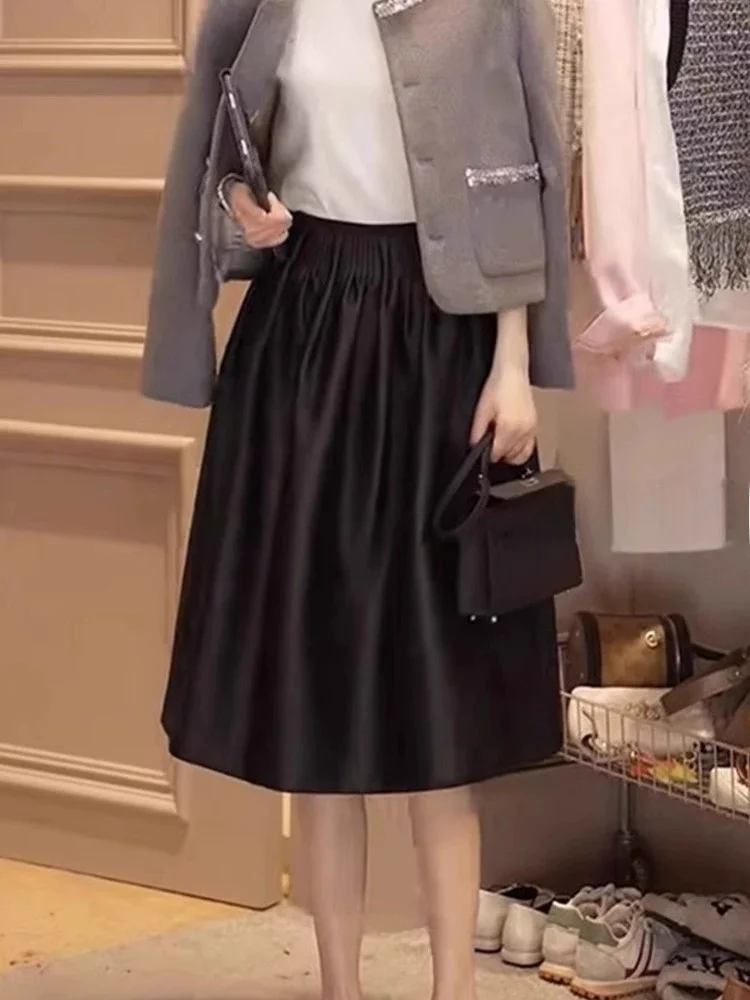 Elegancka letnia spódnica do połowy łydki w stylu koreańskim, idealna do pracy, uniwersalna, wyszczuplająca, bufiasta spódnica damska z wysokim stanem i luźnym krojem.