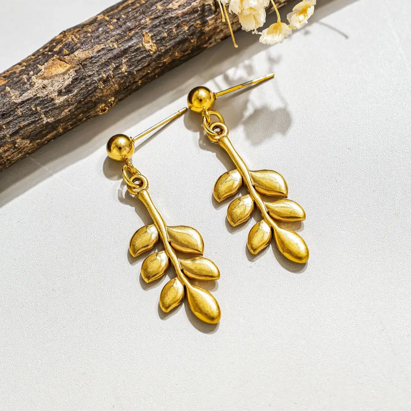 Trendy stainless steel rose, pineapple, four-leaf clover, and leaf pendant earrings, gold bohemian style jewelry, party gift.