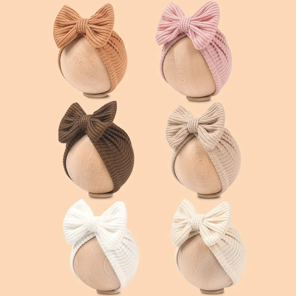 جديد لطيف Bowknot محبوك عمامة بلون دافئ الرضع قبعة قبعة مطاطا البلوز كاب Headerap