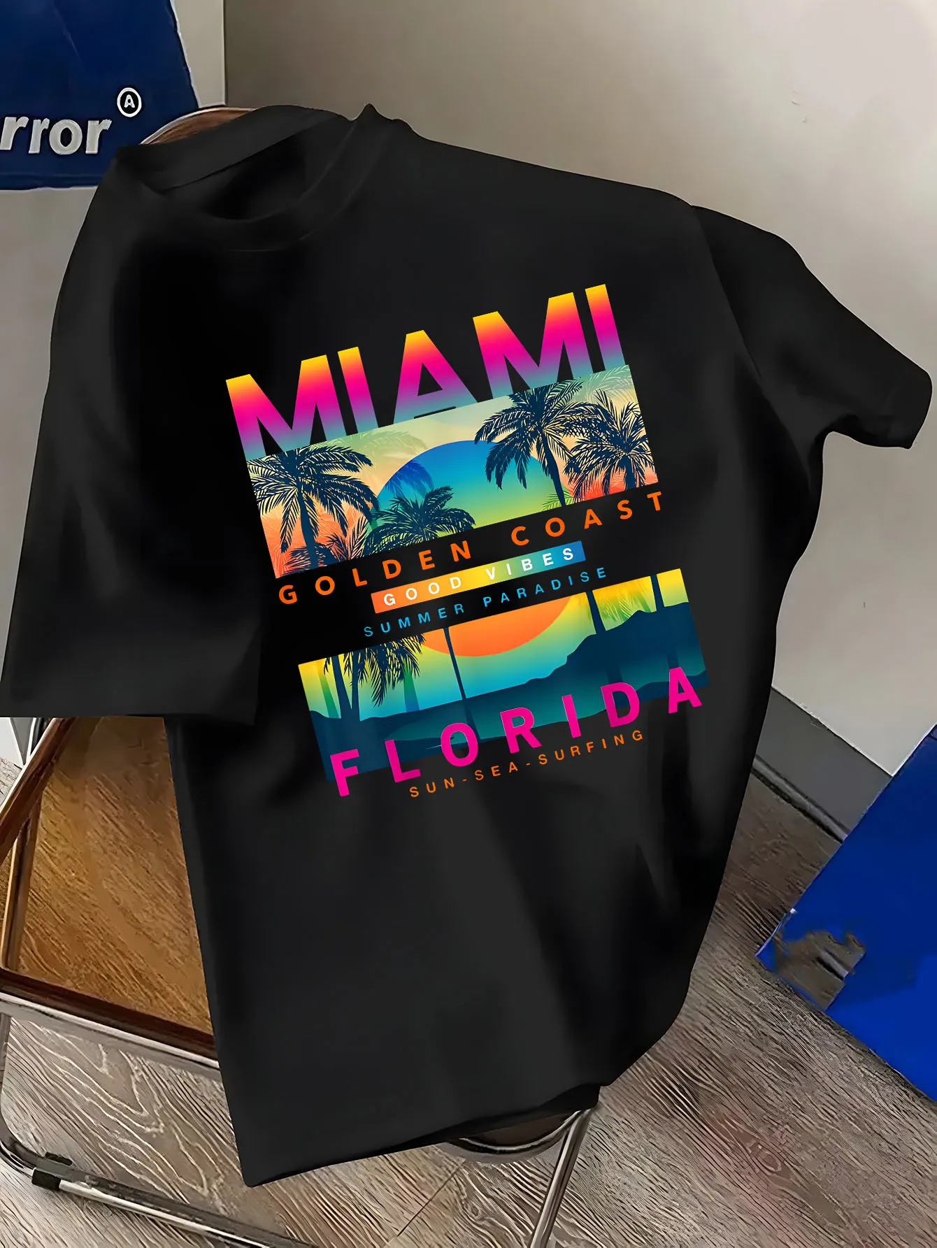 Men's short-sleeved t-shirt with Miami print pattern, featuring Florida palm trees and sunset, representing a summer paradise