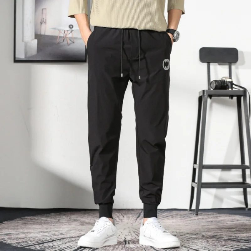 Quick dry ice silk pants men's fashion brand Korean casual pants white nine points sports pants thin air conditioning pants