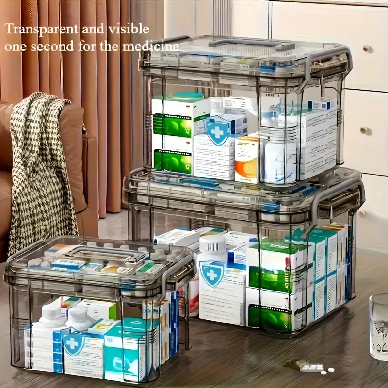 صندوق تخزين أدوية متين بطبقة مزدوجة مع مقبض، يتميز بتصميم رمادي شفاف مقاوم للماء، ضروري للسفر المنزلي