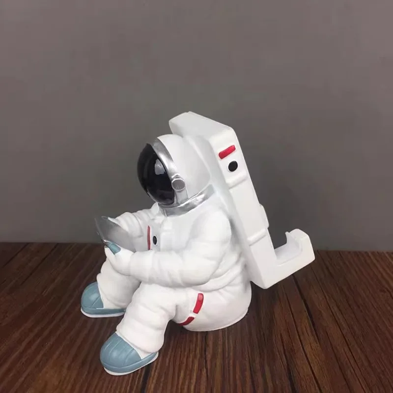 

Cosmonaut Phone Holder Figure Model Craft Creative Space Man Astronaut Sculpture Rocket Plane Ornament Statue Home Decorations