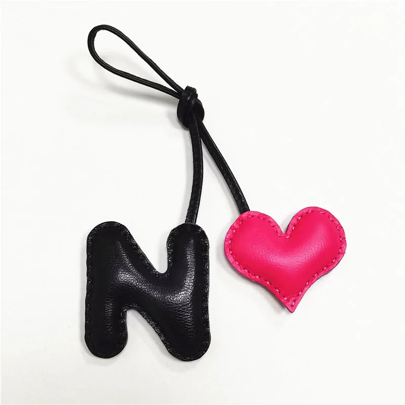 Genuine leather N with heart-shaped letter style bag decoration with pure handmade stitching, high-end car keychain accessories