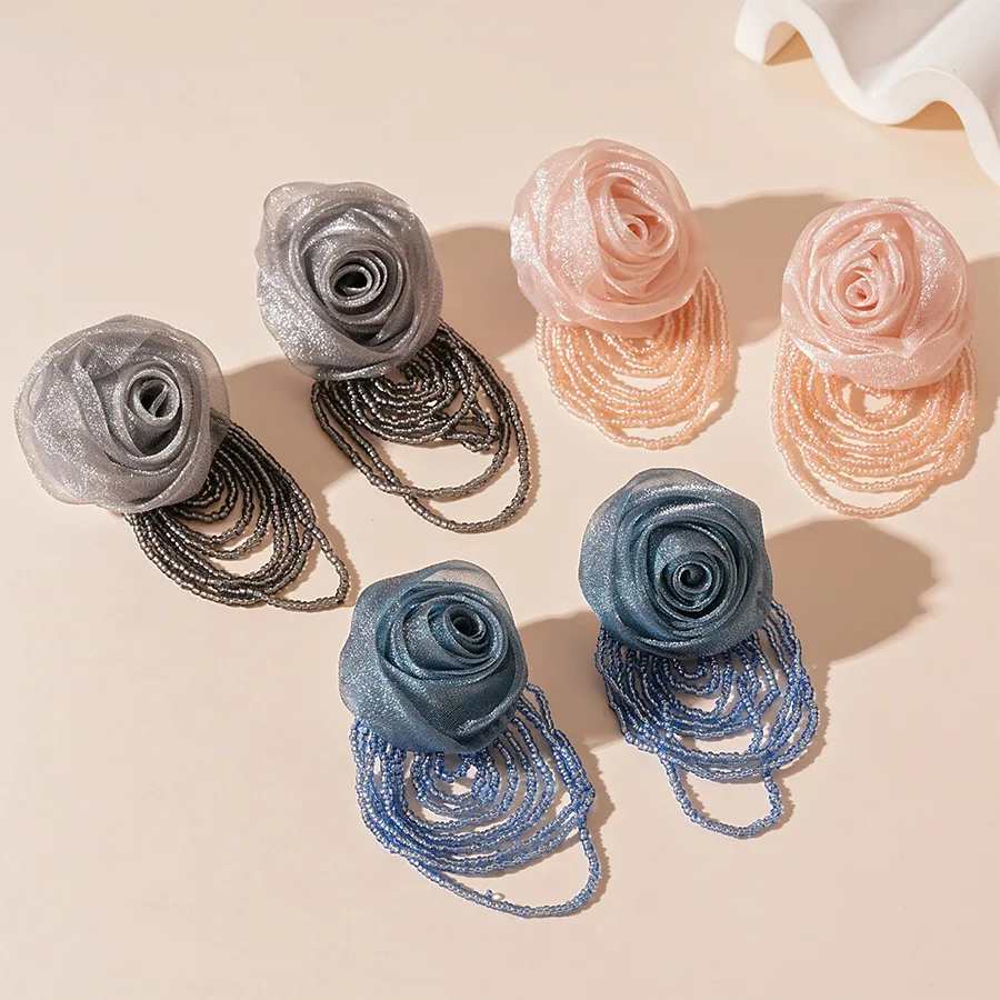 Holiday style woven lace flower rice beads fringed silver needle stud earrings spring and summer sweet temperament elegant high-