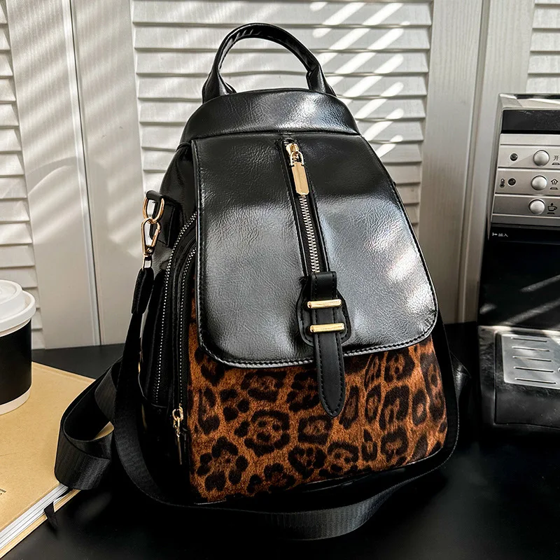

Стильный рюкзак двойного назначения с леопардовым принтом. Универсальная женская сумка через плечо с шикарными кожаными акцентами, идеально подходит для повседневного прогулок.