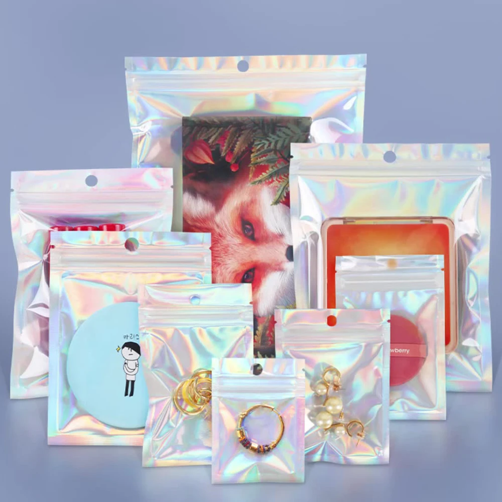 100 Stück/Packung kleine Mylar-Beutel, wiederverschließbarer, geruchsdichter Laser-Kunststoffbeutel, holografischer Beutel mit transparenter Vorderseite für die Mehrzweck-Aufbewahrung