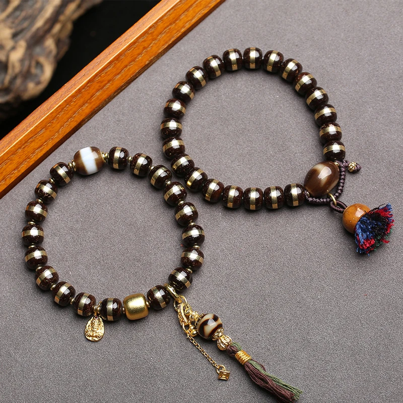 

Черный кокосовый браслет с медной инкрустацией, бусина Дзи из агата в форме тигрового зуба с одной петлей, бусина Дзи из агата в форме тигрового зуба с золотым напылением, цвет фиолетовый рат-голд.