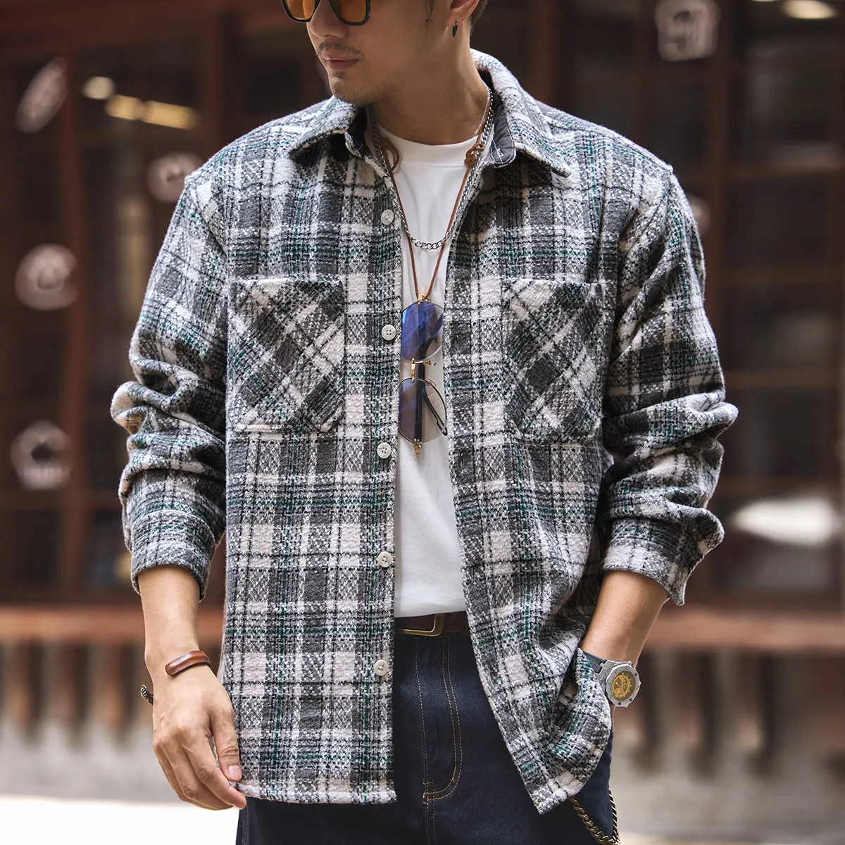 A trendy men's heavyweight knitted checked shirt, a thick, long-sleeved shirt jacket with a lapel for the new autumn collection