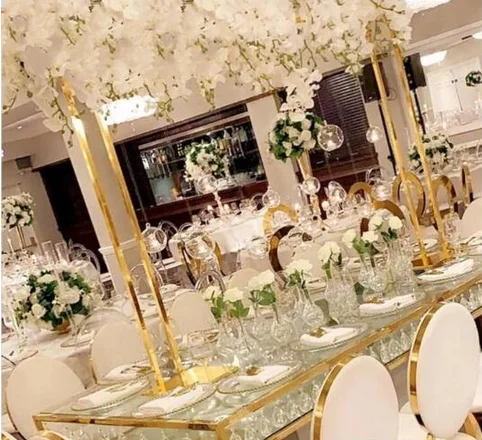 A shiny golden rectangular metal photo frame, wedding pergola, table center piece, wedding decoration