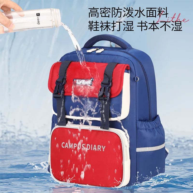 Mochila escolar para niños, de gran capacidad, ideal para estudiantes de primaria, con diseño de bloques de color, tipo bandolera, con múltiples bolsillos.