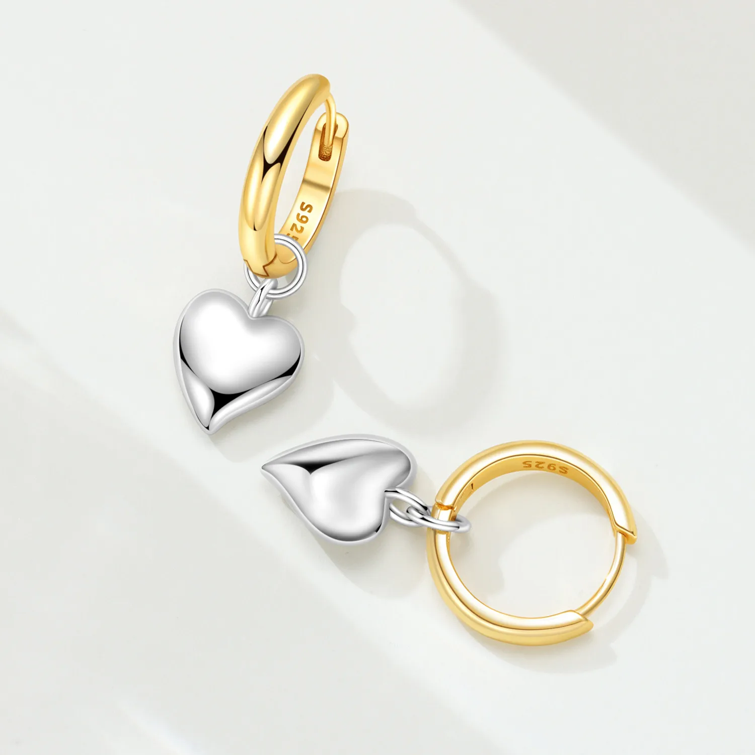 Elegant heart earrings for women featuring gold and silver heart-shaped designs, perfect for gifting and everyday fashion from VelmoraMart.