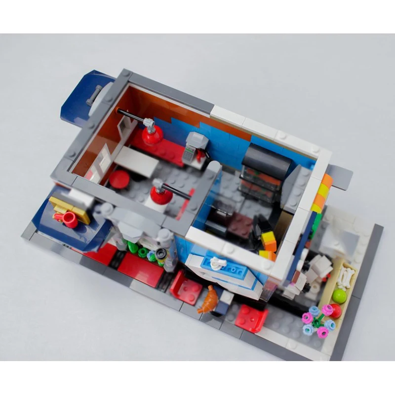 Cidade rua vista modelo moc tijolos de construção pet shop e café tecnologia modular presentes feriado montar crianças brinquedos terno