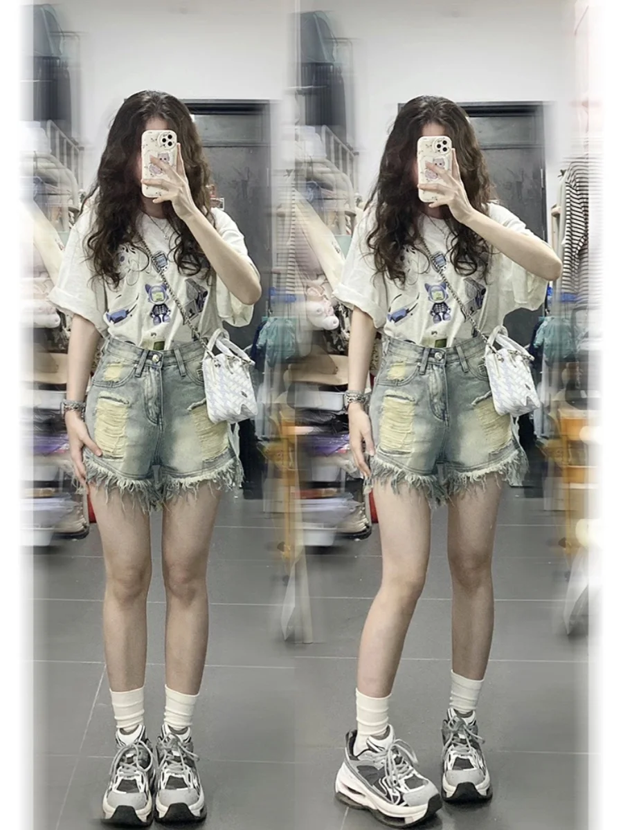 กางเกงยีนส์ขาสั้นเอวสูงแต่งพู่ขาดๆ สำหรับผู้หญิงไซส์ใหญ่ ทรงหลวม ขากว้าง ทรงเอ แฟชั่นฤดูร้อน สไตล์ลำลอง