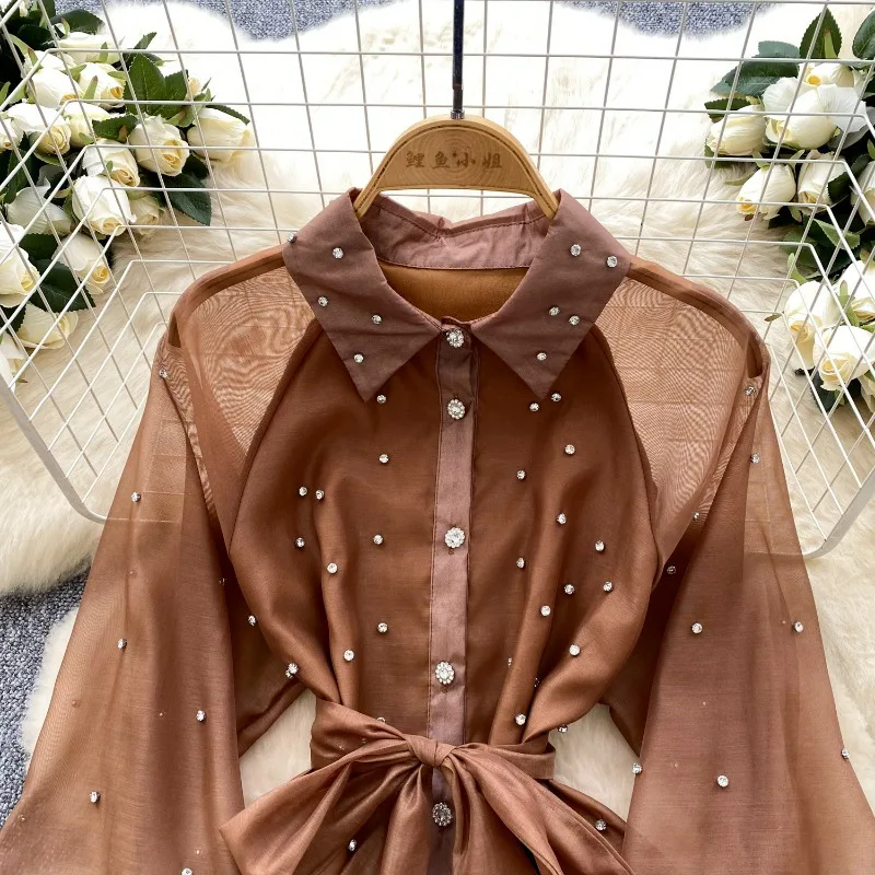 Sukienka damska na wiosnę 2025, francuski styl, ciężki przemysł, diamentowe falbany, sukienka na ramiączkach, podkreślona talia, temperament, koronka, puszysta sukienka.