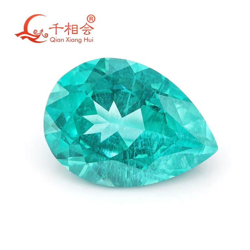 

Paraiba with a neon glow pear shape lab grown Yttrium Aluminum Garnet with inclusions Neon-like gem stone jewelry YAG