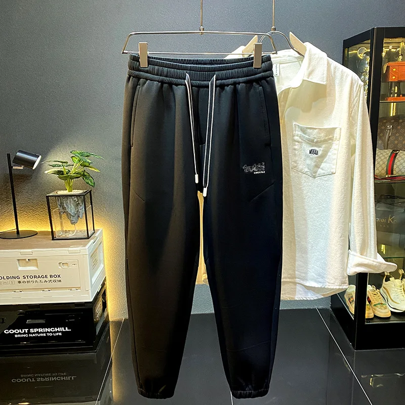 Pantalones deportivos gruesos para hombres, moda de otoño e invierno, pantalones de chándal de punto de alta gama, casuales, versátiles, sueltos, elásticos, atados al tobillo