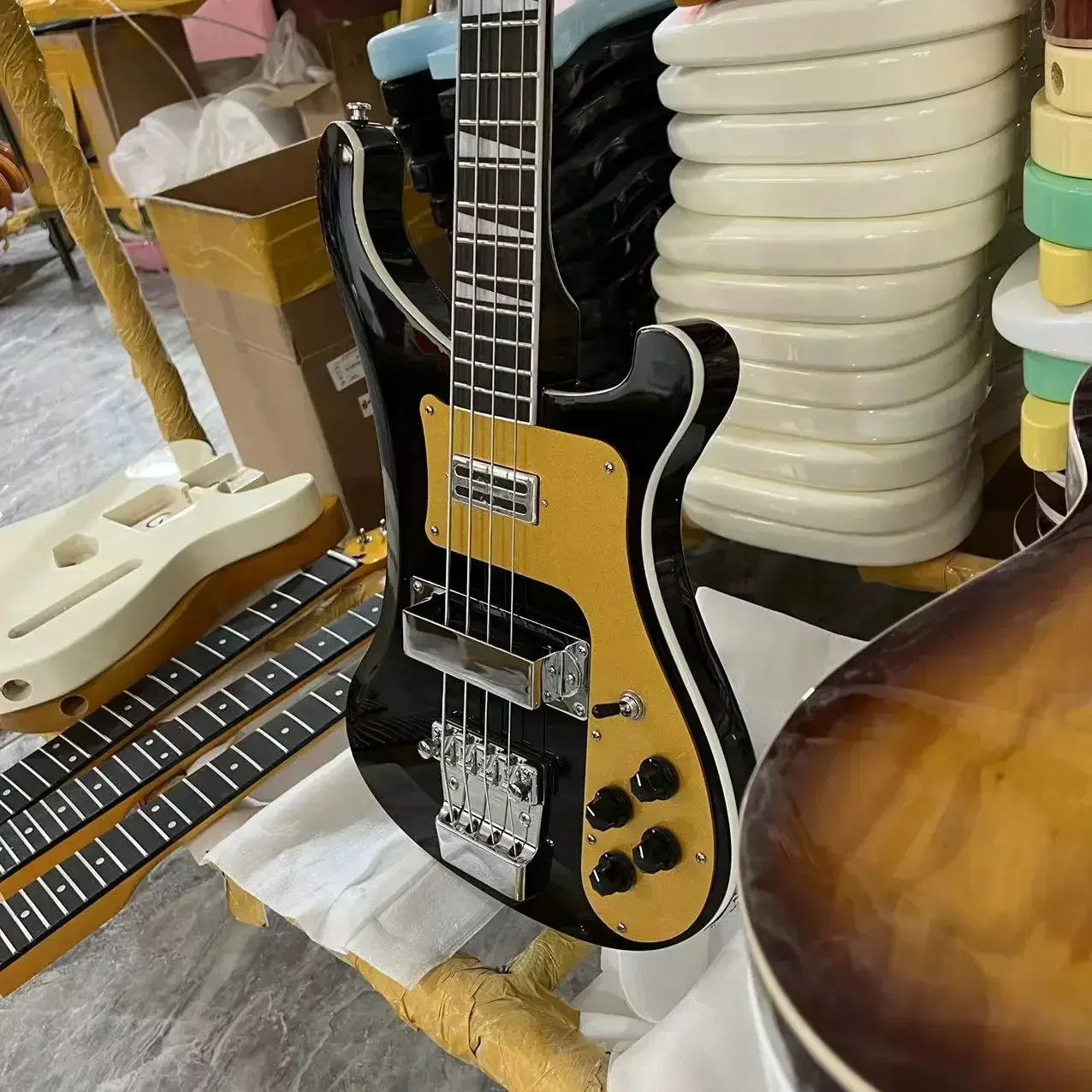 

Newly integrated black electric guitar and bass with 4 strings