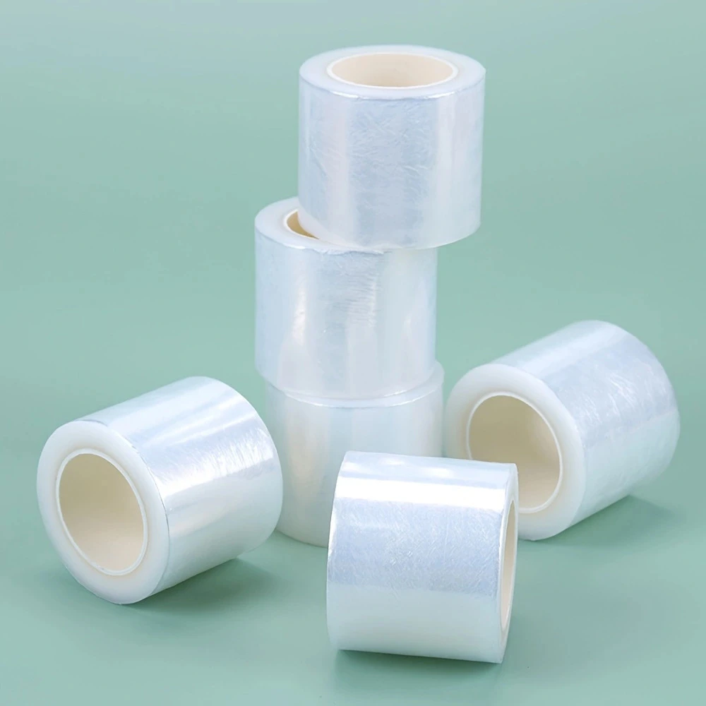 

1 Roll 200M Clear Tattoo Film Wrap Disposable PMU Protective Cover for Eyebrow/Lips 42mm Width Microbead & Eyelash Extension Use
