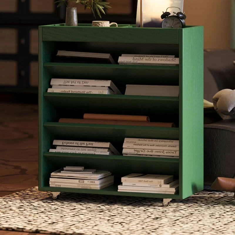 A small wooden movable side storage bookcase beside the desk