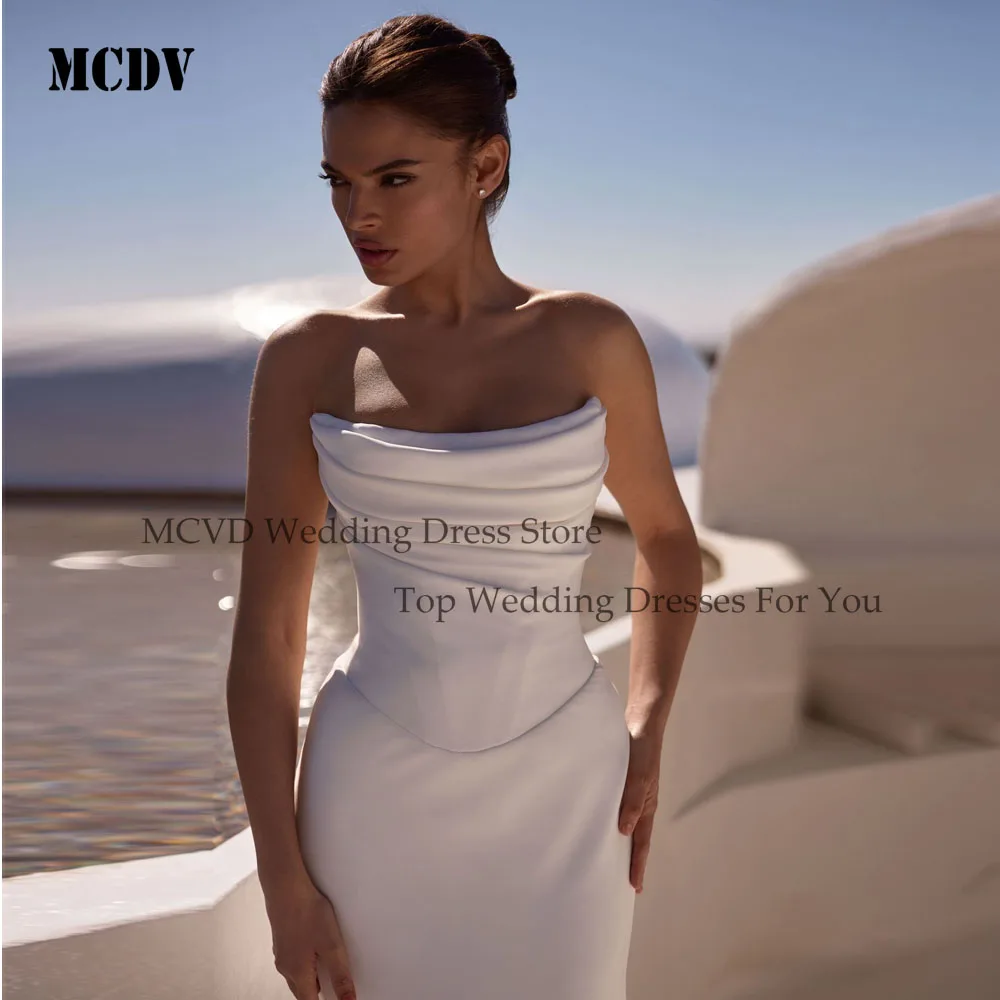 فساتين زفاف MCDV مخصصة بدون حمالات بطيات 2025 حورية البحر بأزرار خلفية بدون أكمام من الساتان فستان العروس عاجي فيستدوس دي نوفيا