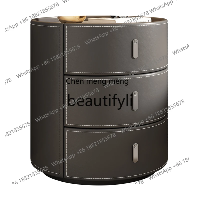 

Saddle leather bedside table Italian minimalist bedroom creative light luxury rock slab solid wood high-end round bedside table