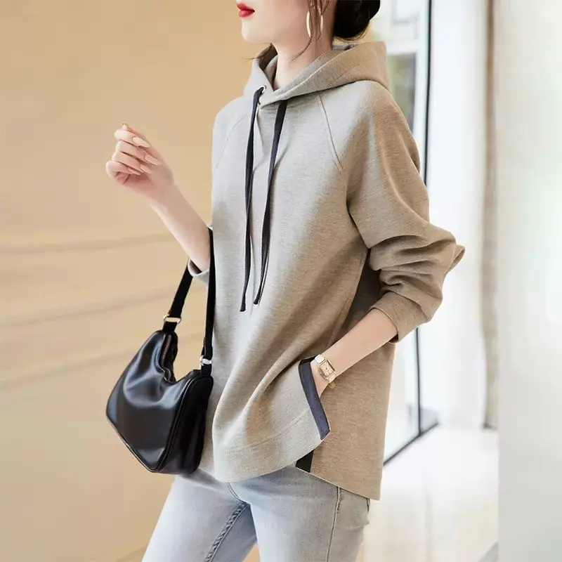 2023 New Spring and Autumn Fashion Trend Minimalist Casual Loose Oversize Long Sleeved Hem Split Hooded Tie Up Sweater for Women