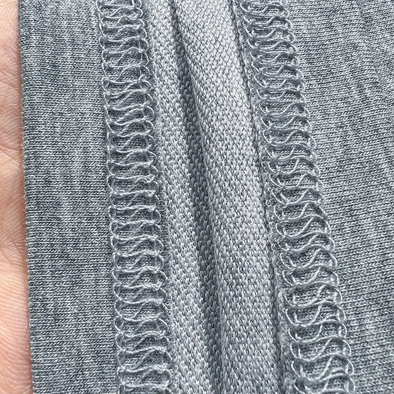 تي شيرت نسائي بكتف واحد على الطراز الفرنسي بأكمام قصيرة صيفي متوسط الأكمام محبوك من الأسفل نصف كم أحمر بكتف واحد عالي