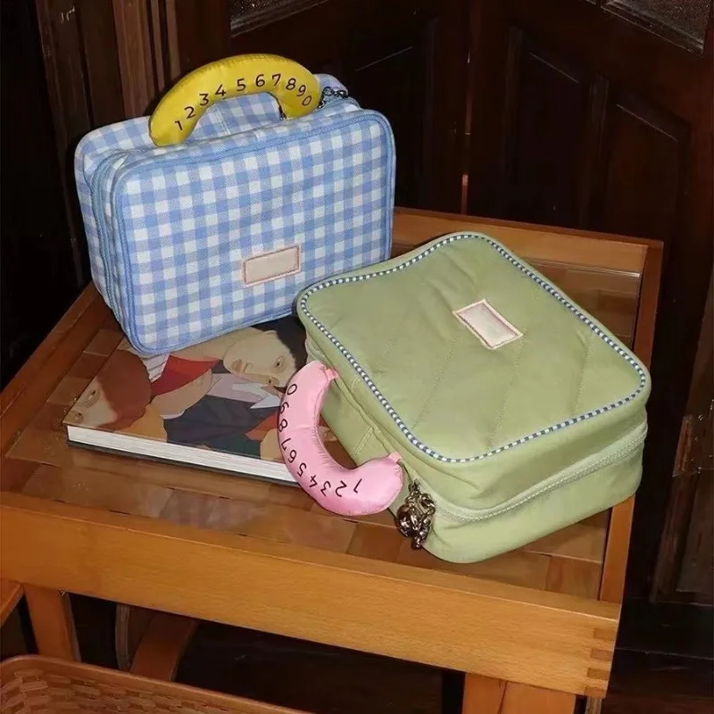 Borsa per il trucco da gita per studenti di stoccaggio carino di alta bellezza con griglia da donna borsa per il lavaggio del trucco portatile di