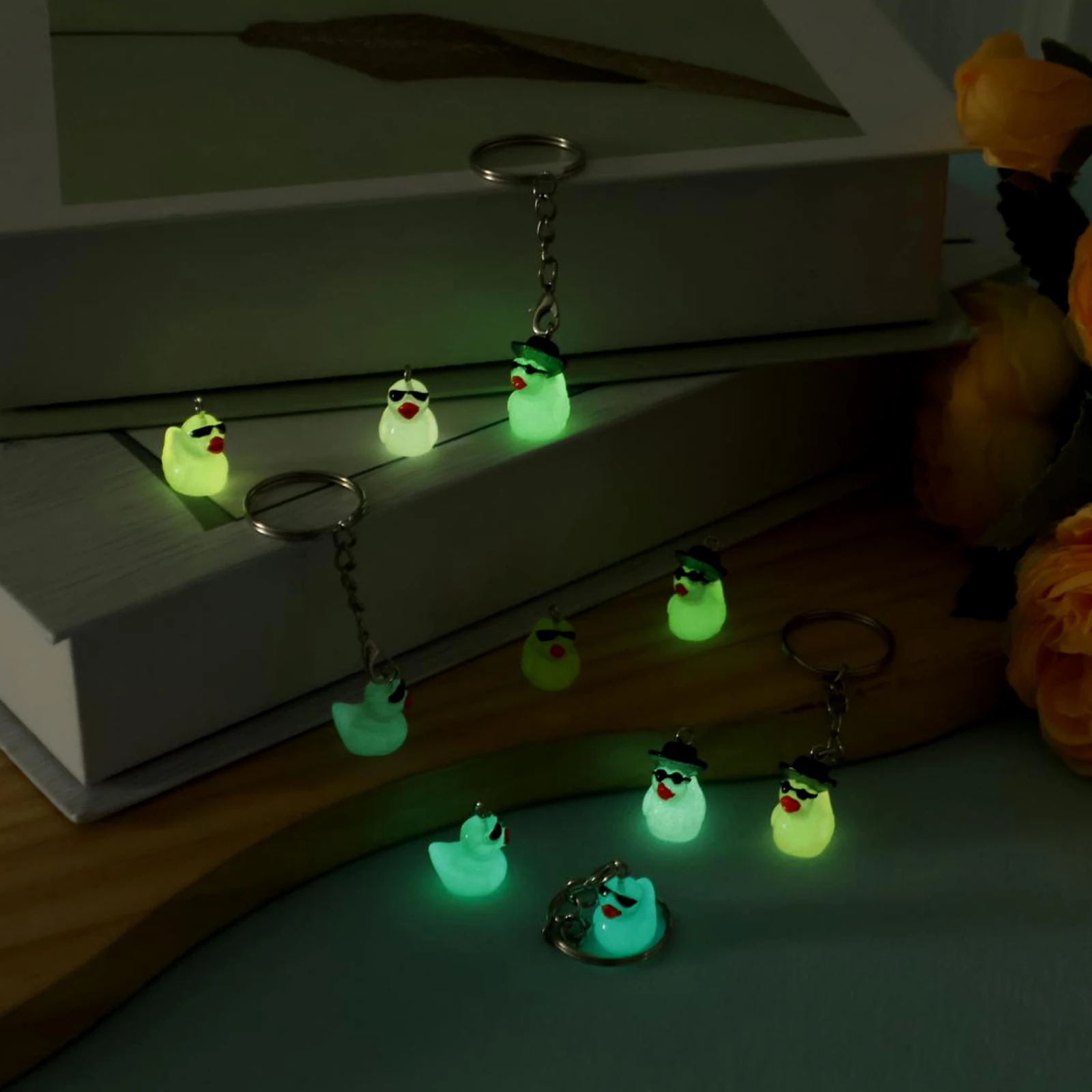 100Pcs Luminous Mini Duck Keychains 3D Cute Glow in the Dark Duck Resin Keychains Small Ducky Pendant Accessories for Party