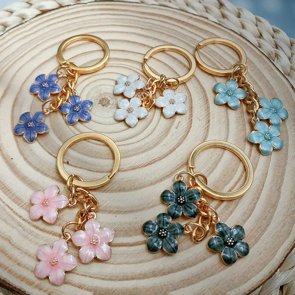 Niedlicher Emaille-Schlüsselanhänger, bunter Sakura-Blumen-Schlüsselanhänger, süße Schlüsselanhänger für Frauen und Mädchen, Handtaschen-Zubehör, DIY-Schmuck, Geschenke