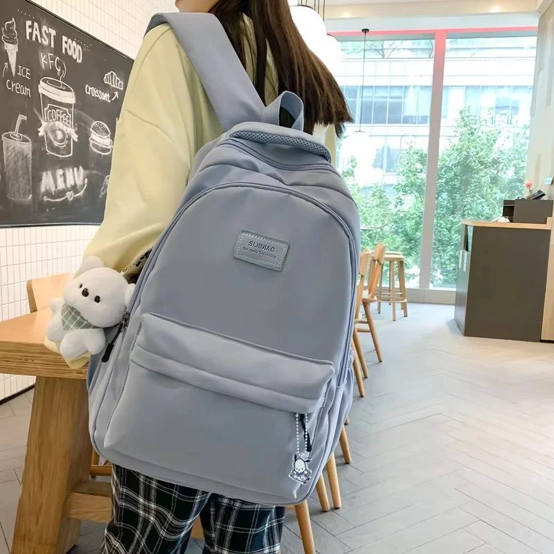 Nueva mochila universitaria impermeable de alta capacidad a la moda para hombre y mujer, mochilas escolares para ordenador portátil para mujer,