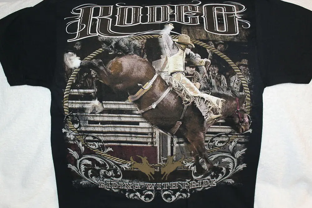 RODEO COWBOY RIDING BUCKING HORSE BRONCO RIDING WITH PRIDE T-SHIRT