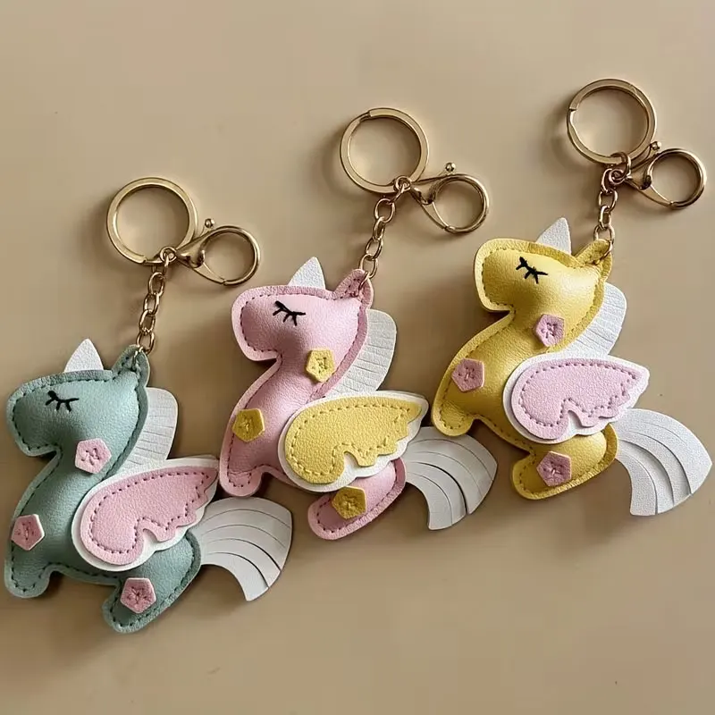1Pc Cute Unicorn Keychain with Heart-Shaped Cutouts and Expressive Eyes - Soft Colors - Durable Fabric Material with Black Outline and Heart-Shaped Pattern - Lobster Clasp for Bag and Backpack Decoration, Birthday Party Gift, Fashionable Accessory for Daily Use - Pendant
