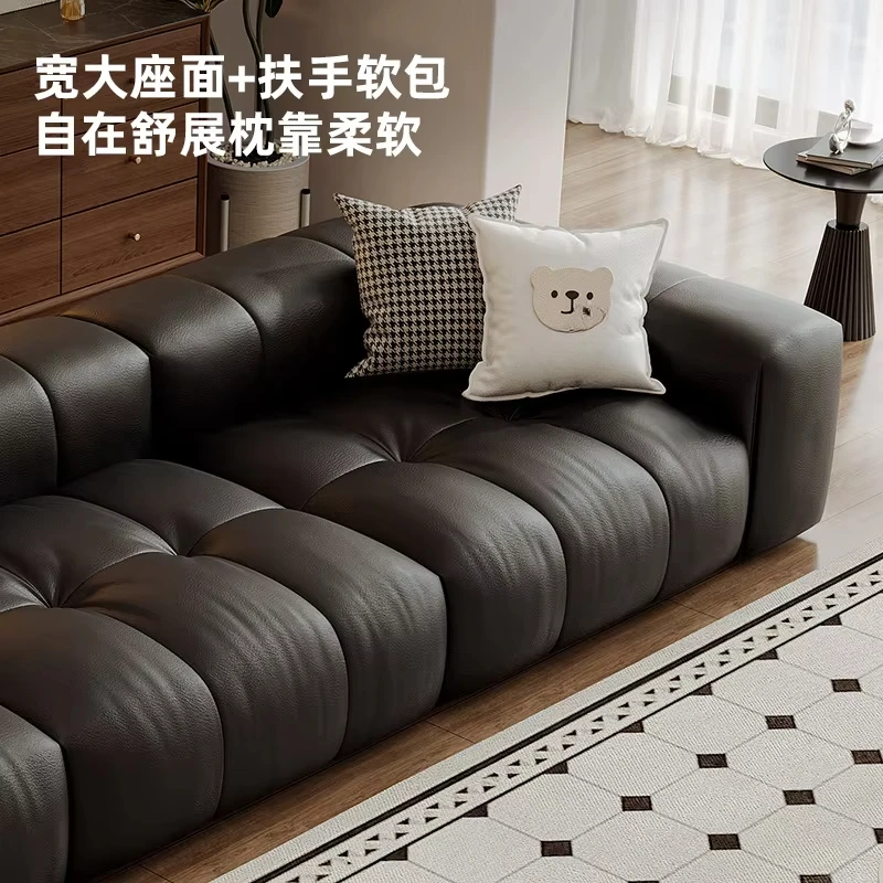 The first layer of cowhide is simple and modern living room, straight row puff sofa