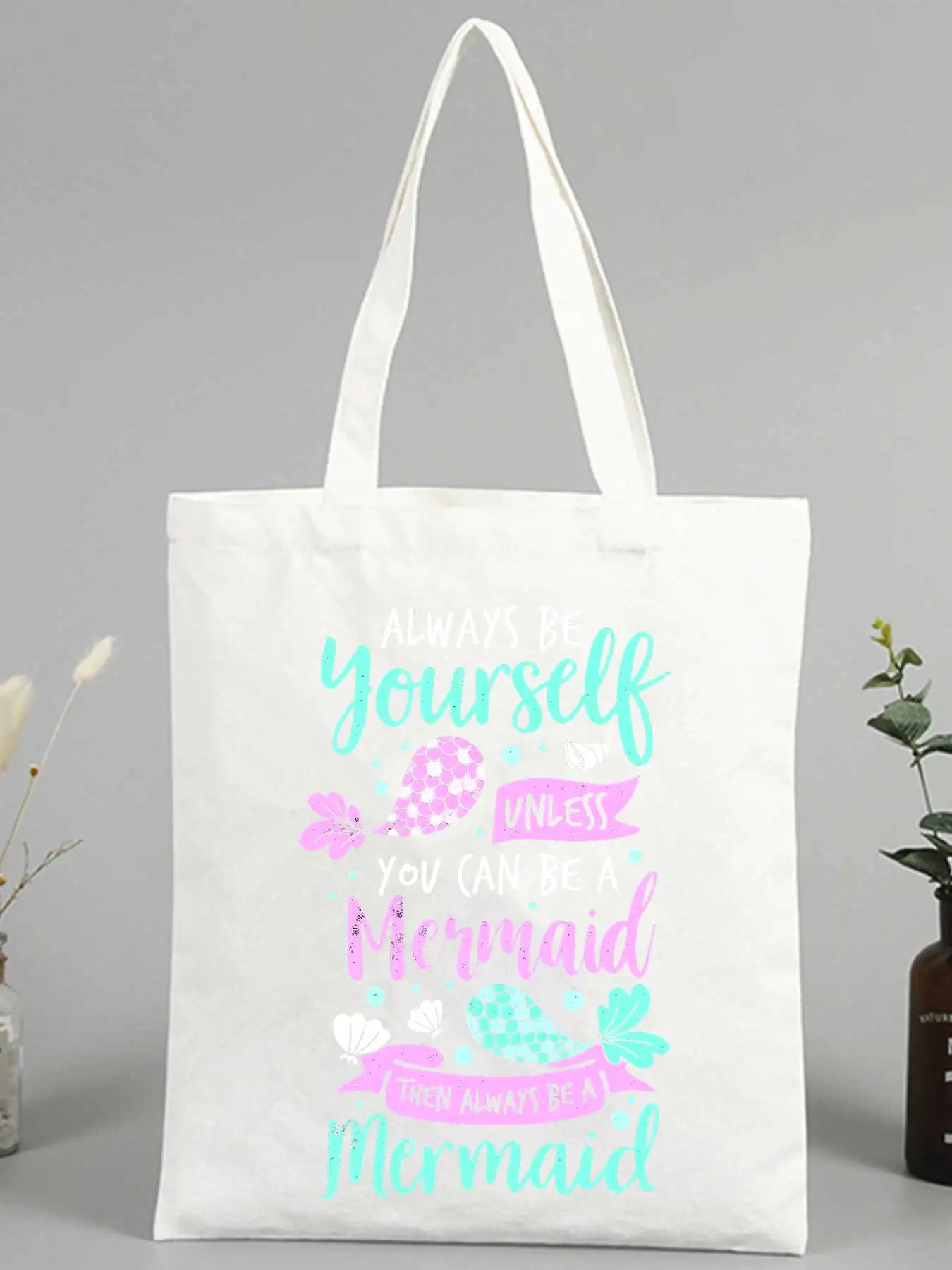 Women's fantasy creature print canvas tote bag with slogan-style graphic, ideal for summer outings and casual use