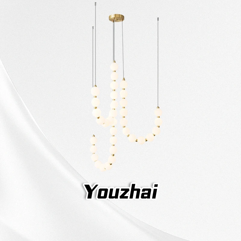 

Italian style Buddha bead staircase pendant light, modern minimalist villa living room light, cream apartment pendant light