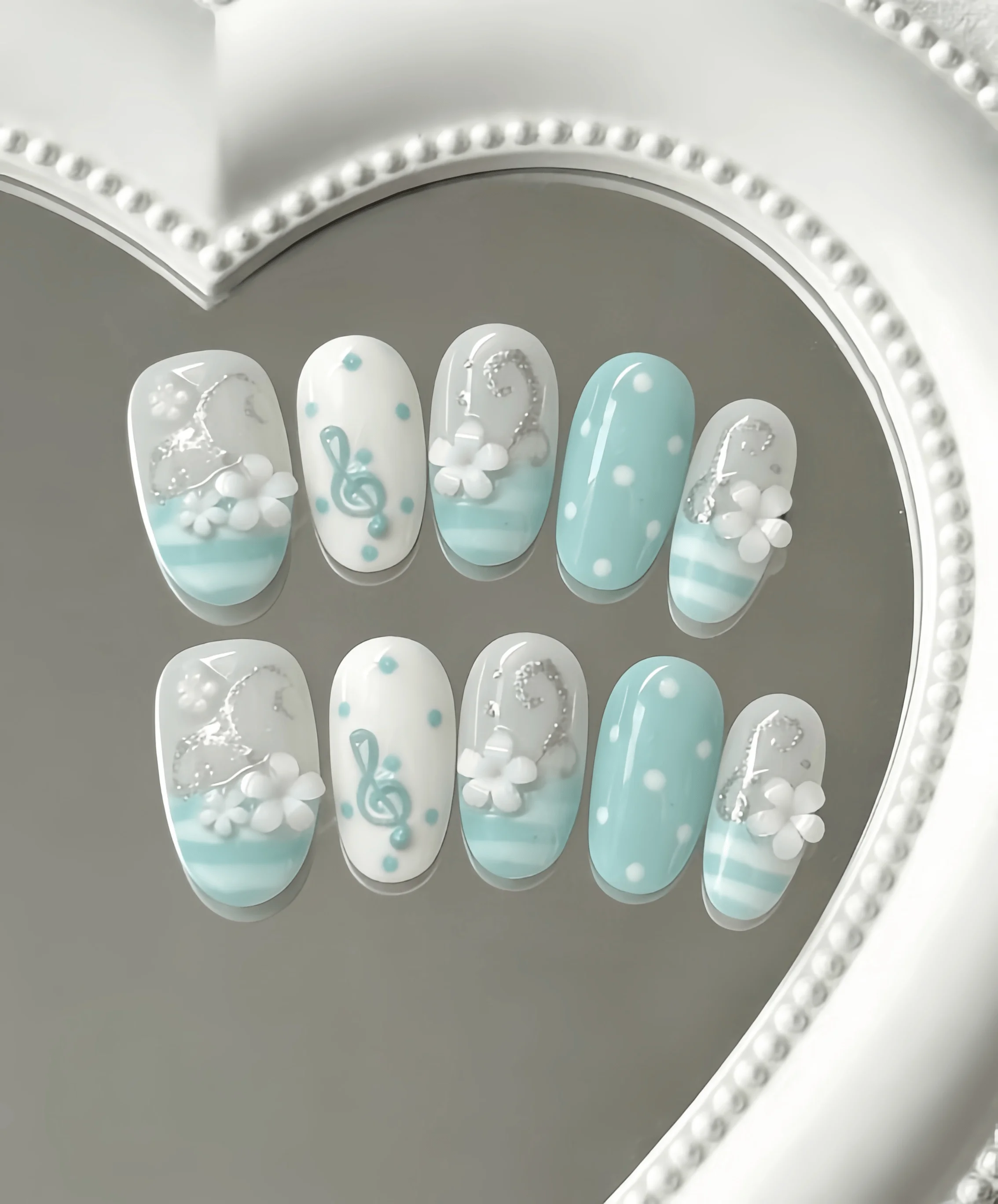 10 Pieces of Oval-Shaped Light Blue Musical Note Floral Handmade Full-Cover Nail Tips, Fresh and Sweet Y2K Style, Featuring Musical Notes, 3D Flowers, and Polka Dots, with Hand-Painted Lines and 3D Decoration Techniques, Suitable for Girls' Summer Vacations, Graduation Season, and Everyday Commuting, Campus Life, and Fresh Date Scenes, Comes with Jelly Glue and Nail File