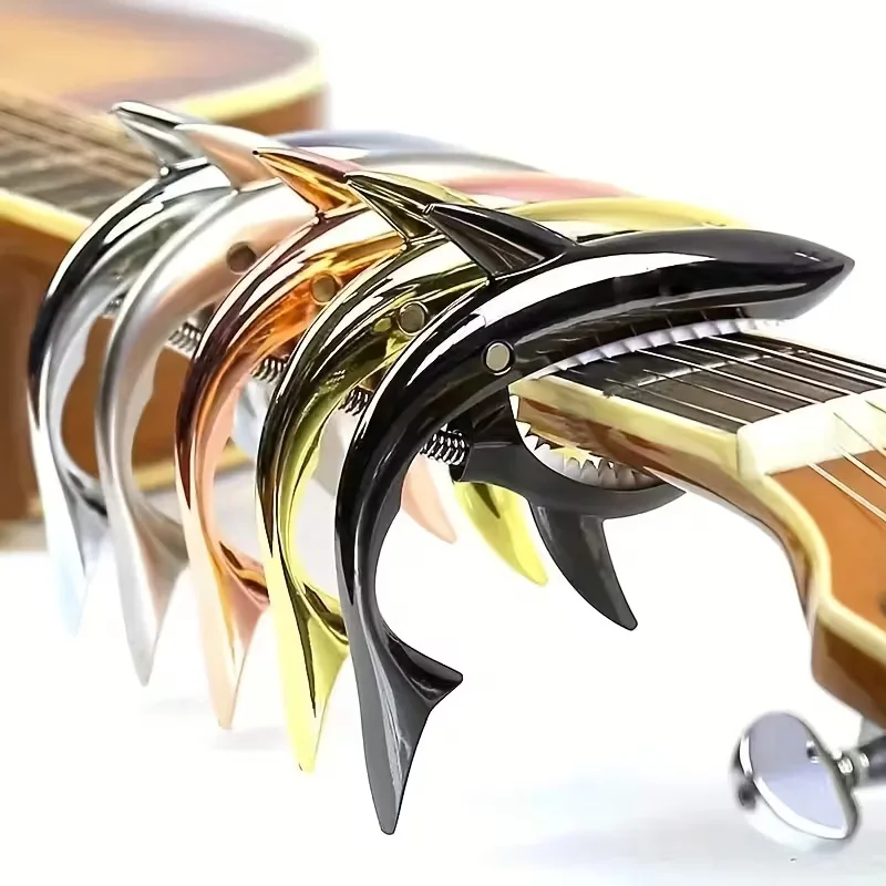 Cejilla de guitarra Shark de Metal, aleación de Zinc de alta calidad para guitarra acústica, guitarra electrónica, ukelele y bajo, agarre ergonómico