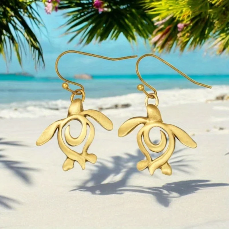 A pair of leisure vacation ocean style Women's earrings, turtle shaped hollow earrings, worn for vacation and summer daily wear