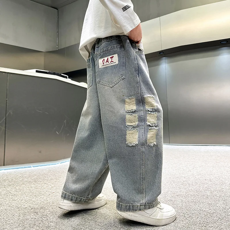 نمط جديد الأطفال فضفاض مستقيم دمرت الجينز للمراهقين الصبي عادية ممزق الدينيم السراويل الكورية الاطفال موضة بنطلون سن 4-14Y